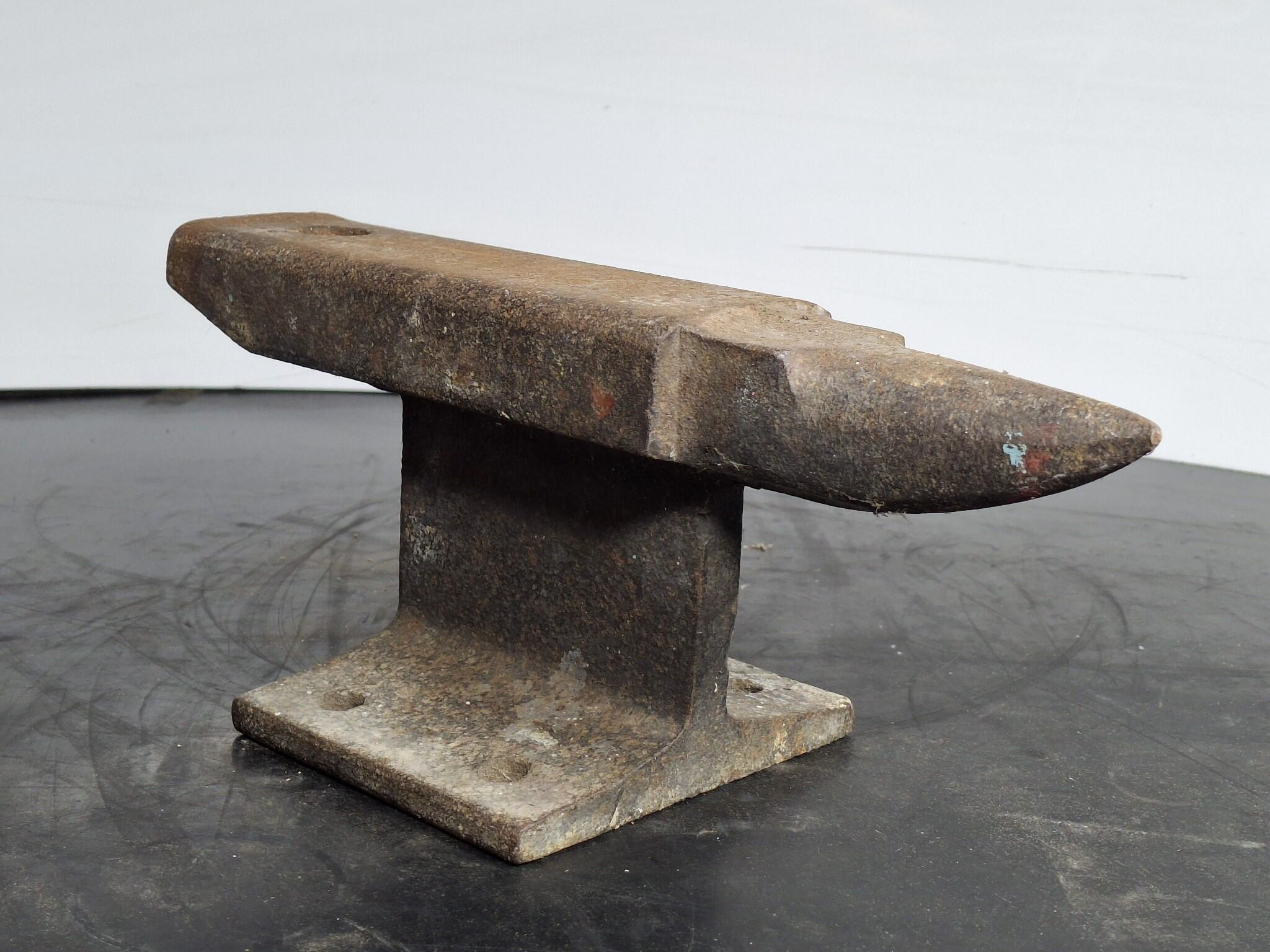 Small steel anvil on base stand