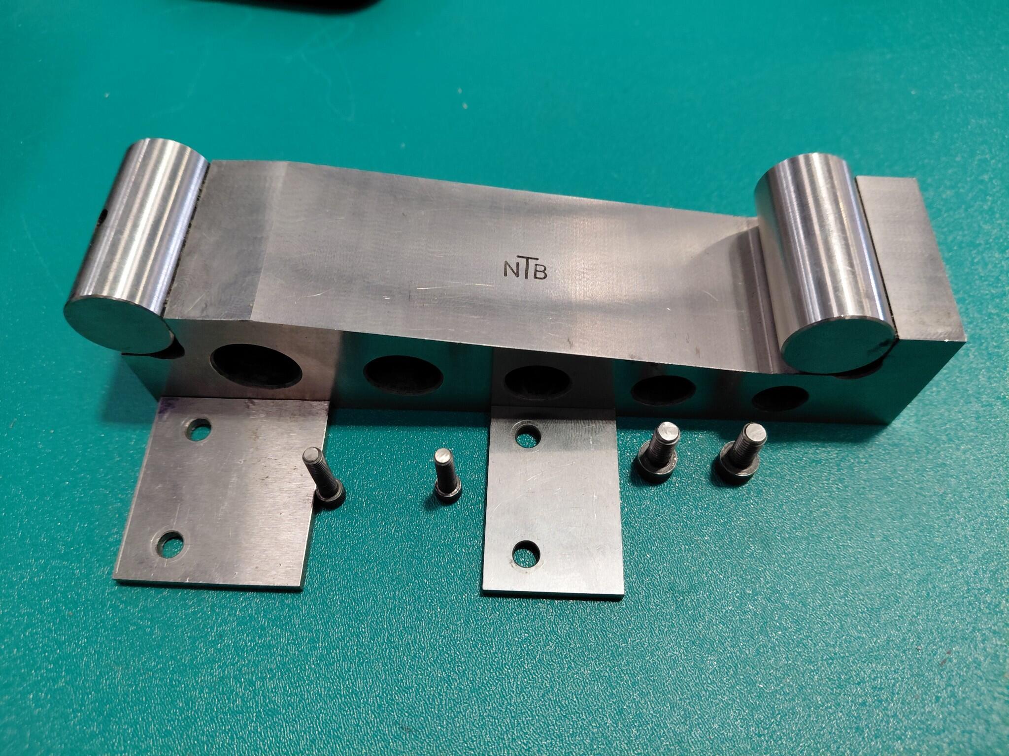NTB metal block with plates and pins in wooden box