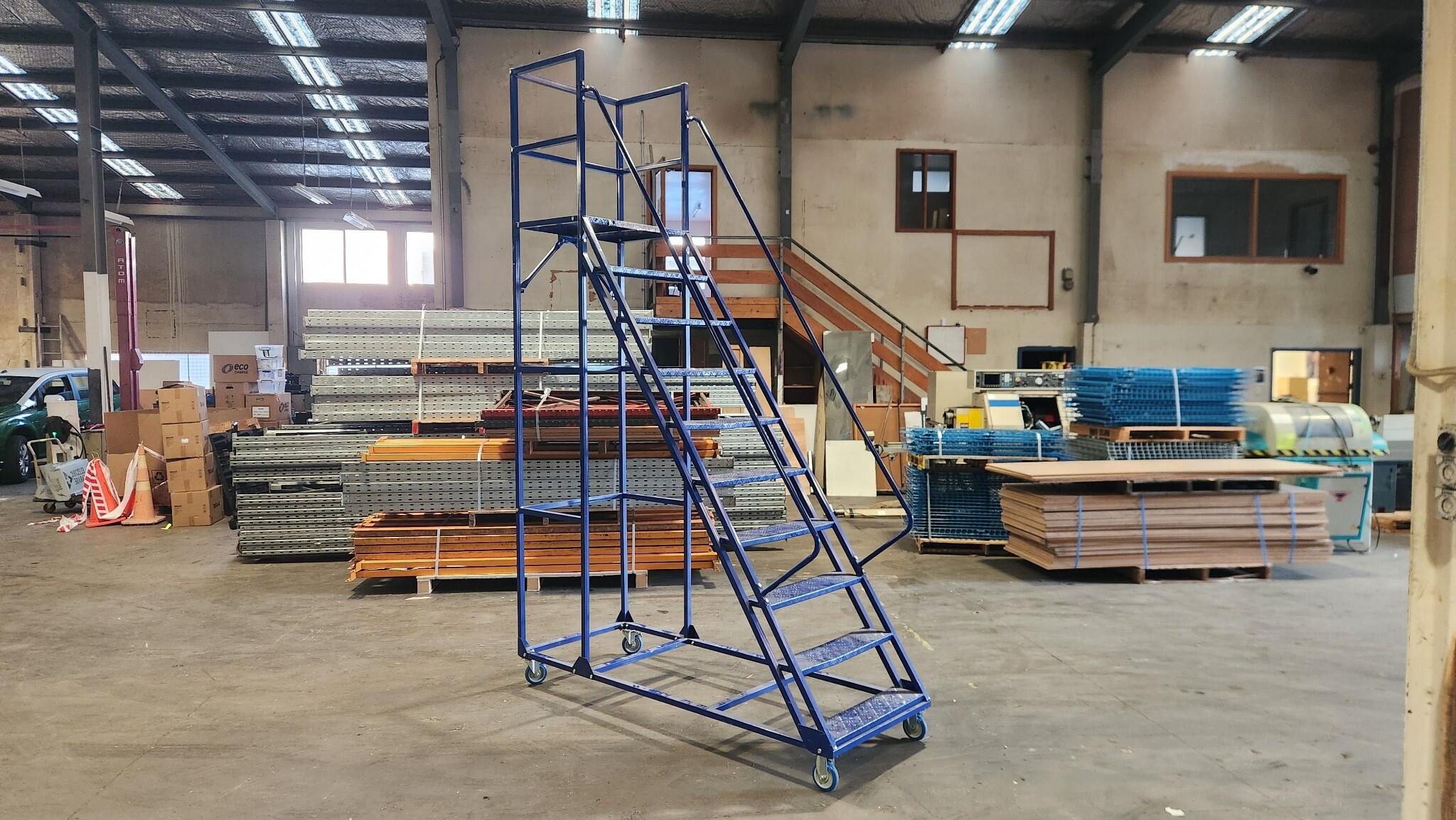 Blue mobile warehouse platform ladder
