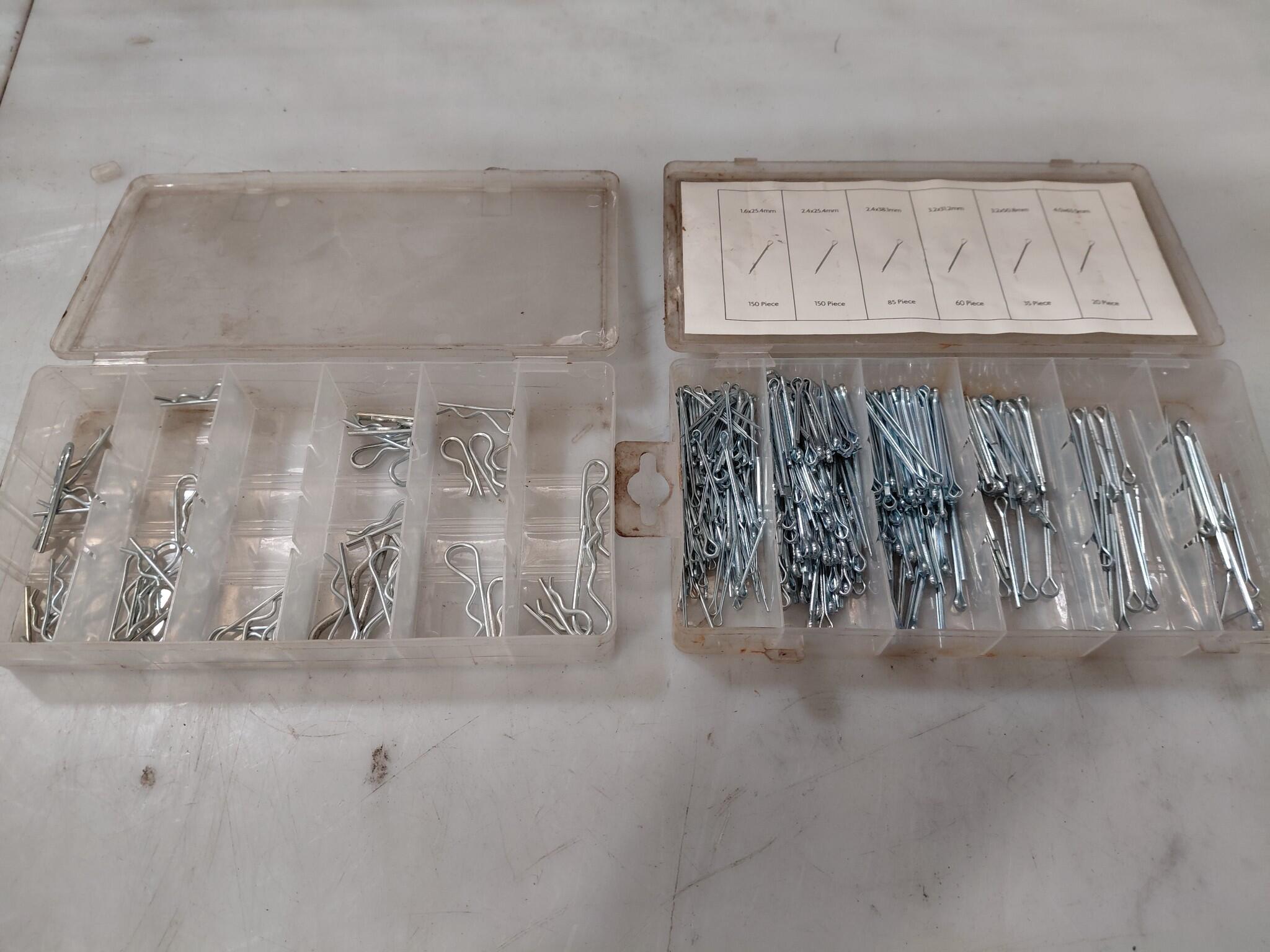 Assorted split pins and R clips in plastic cases
