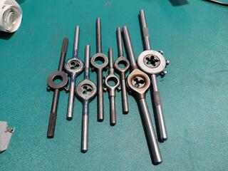 Set of die stocks and round threading dies