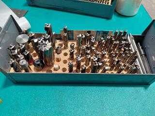 Assorted metal cutting tools in steel drawer