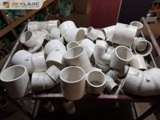 Quantity of White PVC Pipe Fittings