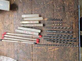 Assorted Drill Bits and Storage Tubes