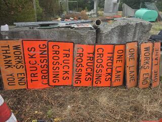 List the number and words on each sign, nothing else