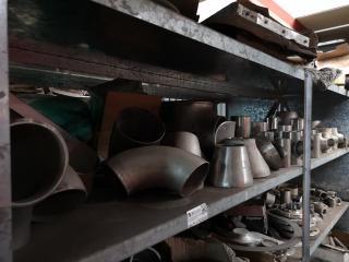 Shelf of Assorted Stainless Steel Pipe Fittings