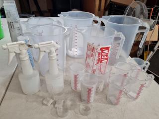 Assorted Plastic Measuring Jugs, Vials, Cups, Sprayers, & More