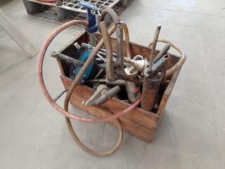 Box of assorted manual grease pumps and hoses
