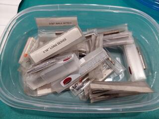 Assorted small HSS cutters and end mills